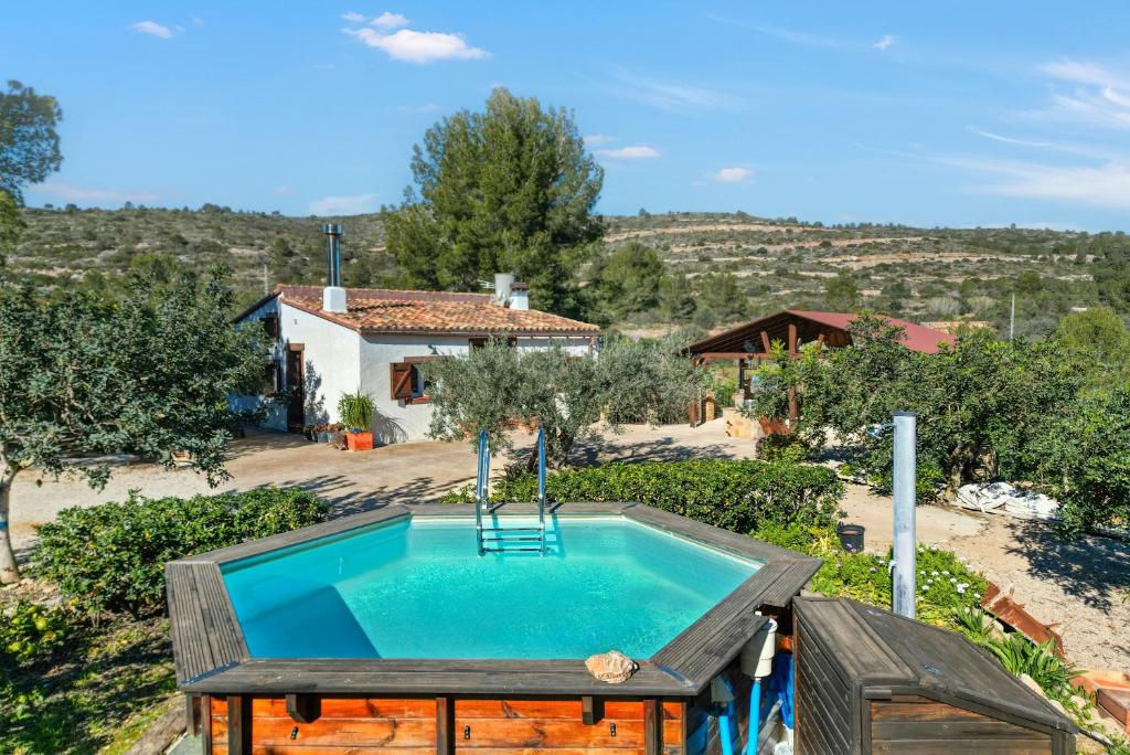 Exterior view of the house and pool